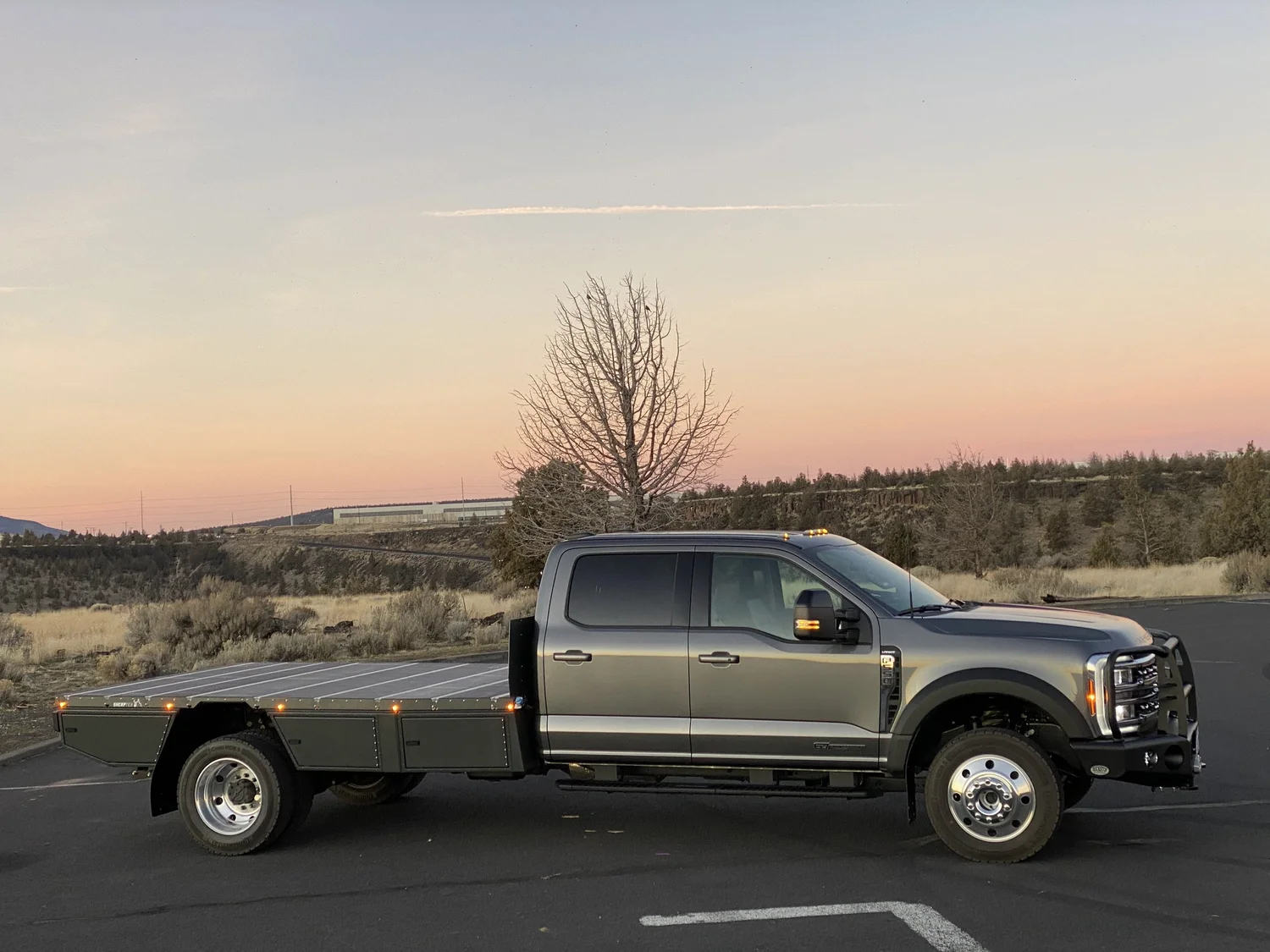 Heavy duty flatbed truck at sunset — TruckBedShop